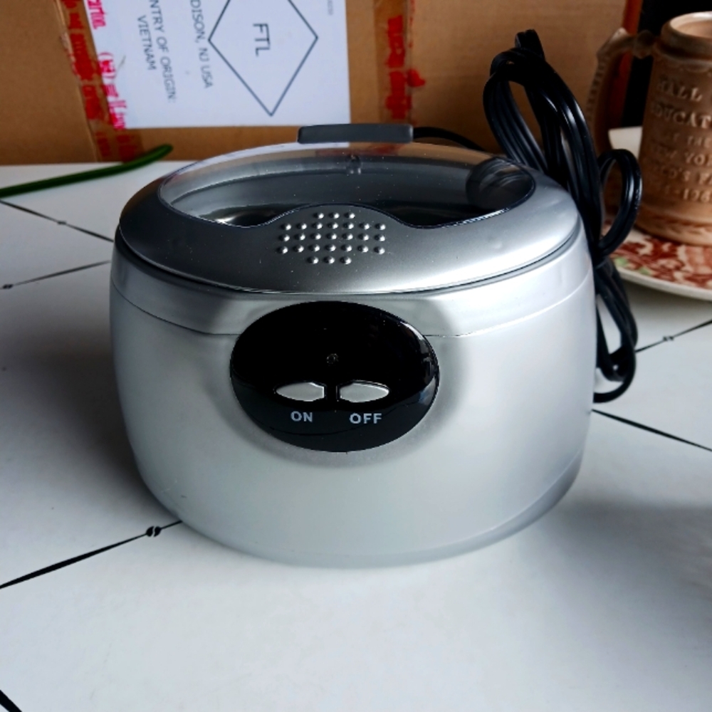 Sleek Silver and Black Portable Audio Device with Modern Design
